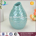 YSv0067-04 Embossed porcelain mini vase with pearlized finishing